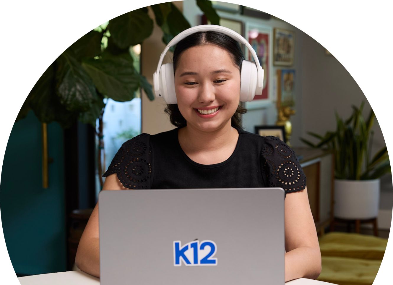 High school student wearing a whit epair of headphones