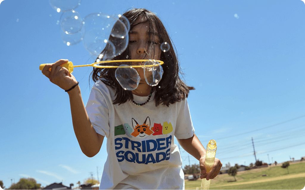 Student playing with bubbles