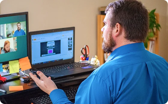 Teaching working with his laptop